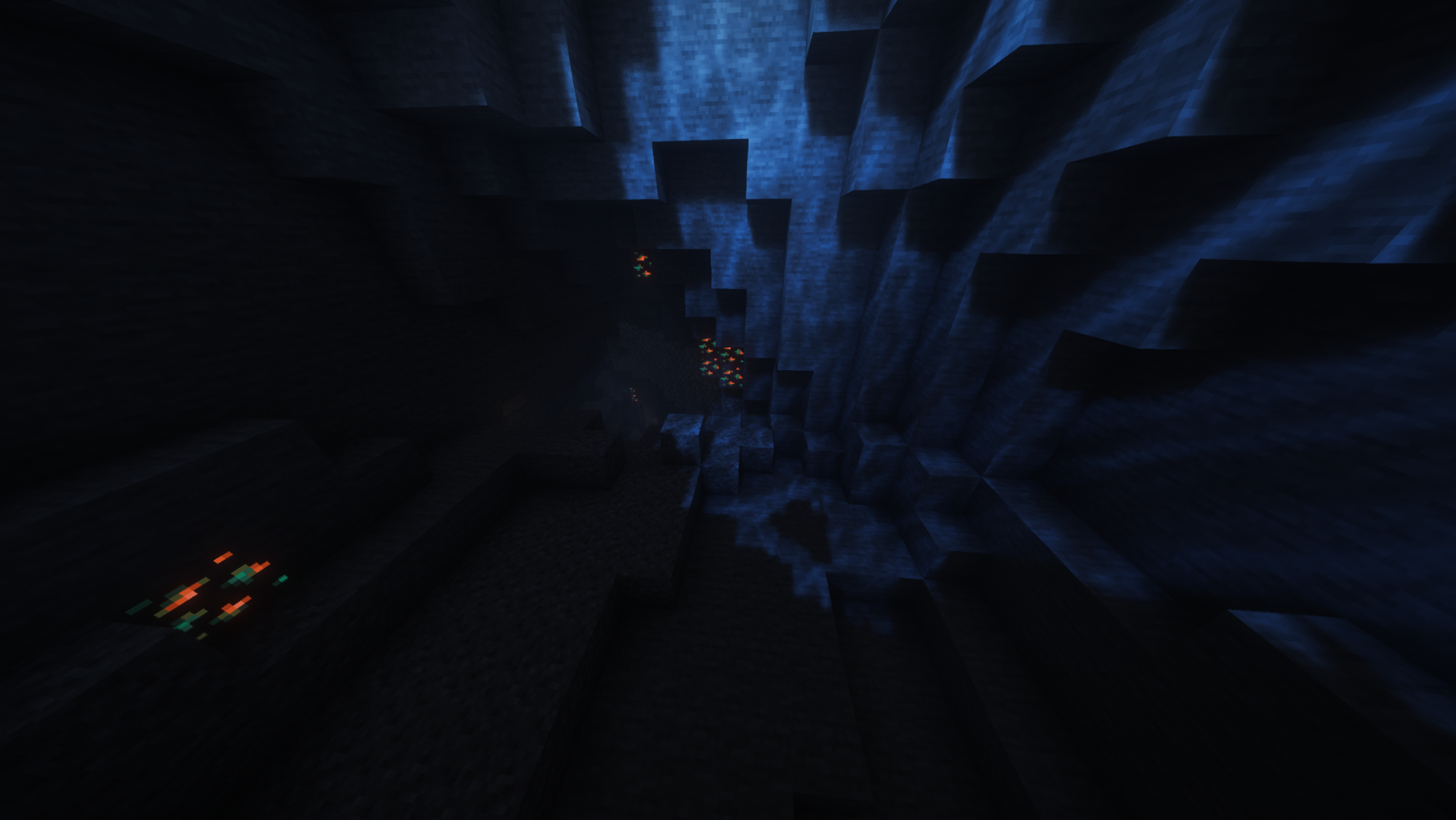 A deep cave in Chippedsmp with glowing ore visible in the distance